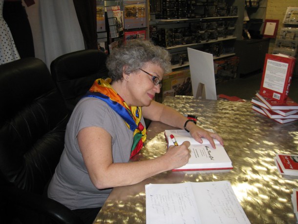 Hard at work signing.