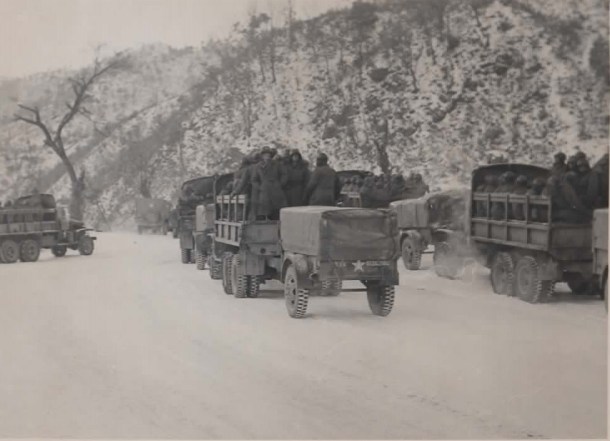 Rachael writes:  "My grandfather's caption reads: The Road Back after endless months in Korea. The trip to Chuncheon has begun and the convoy eagerly starts rolling despite the freezing weather, Jan '52." 