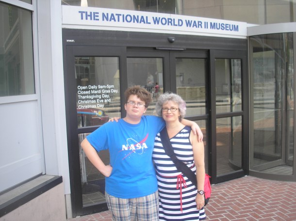 With John in front of the National World War II Museum, New Orleans.  Photo by Jim Kilfoyle.